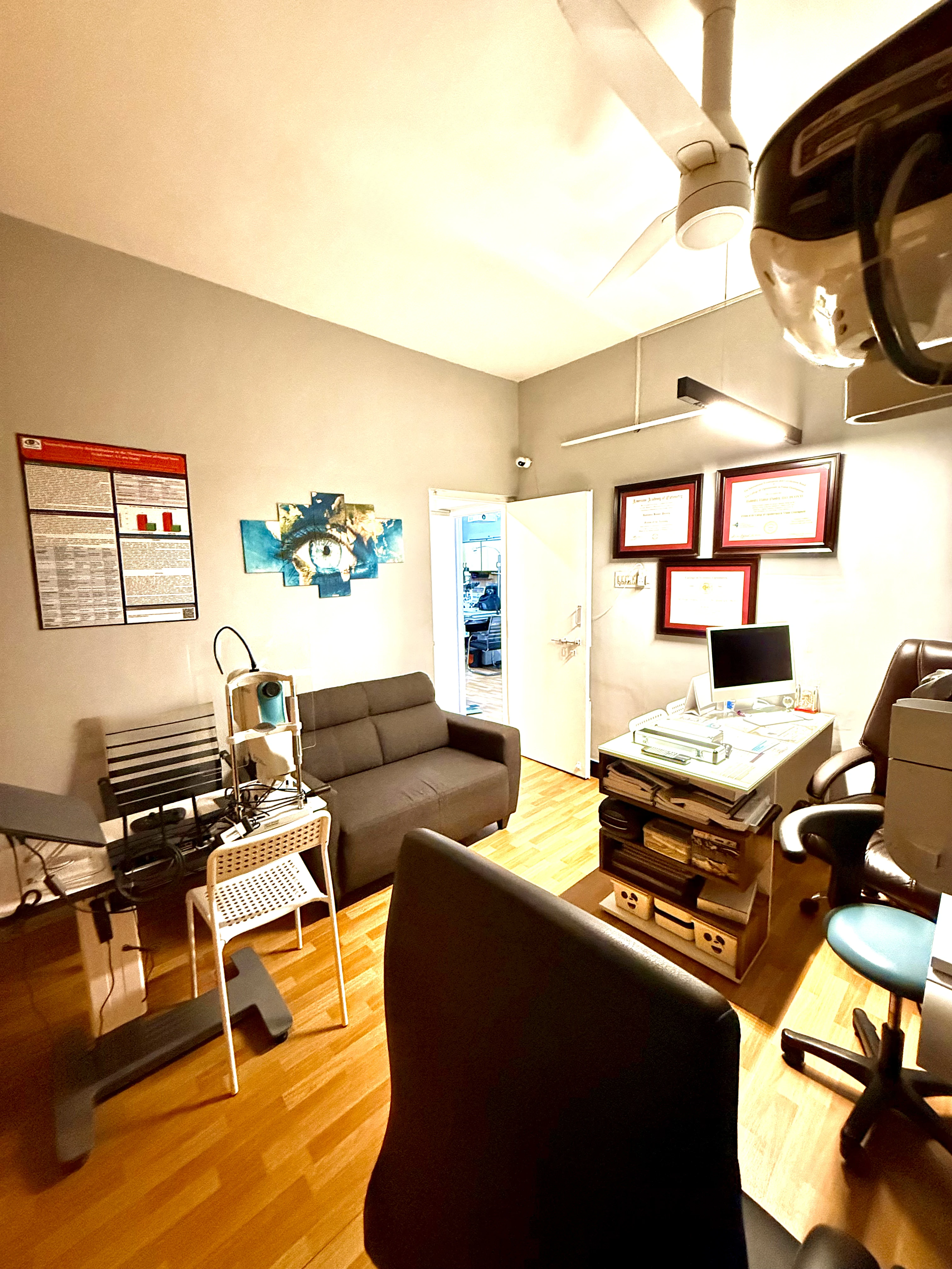 Caring Vision Therapy Ashok Nagar Chennai – Examination room with patient sofa, diagnostic instruments and certificates