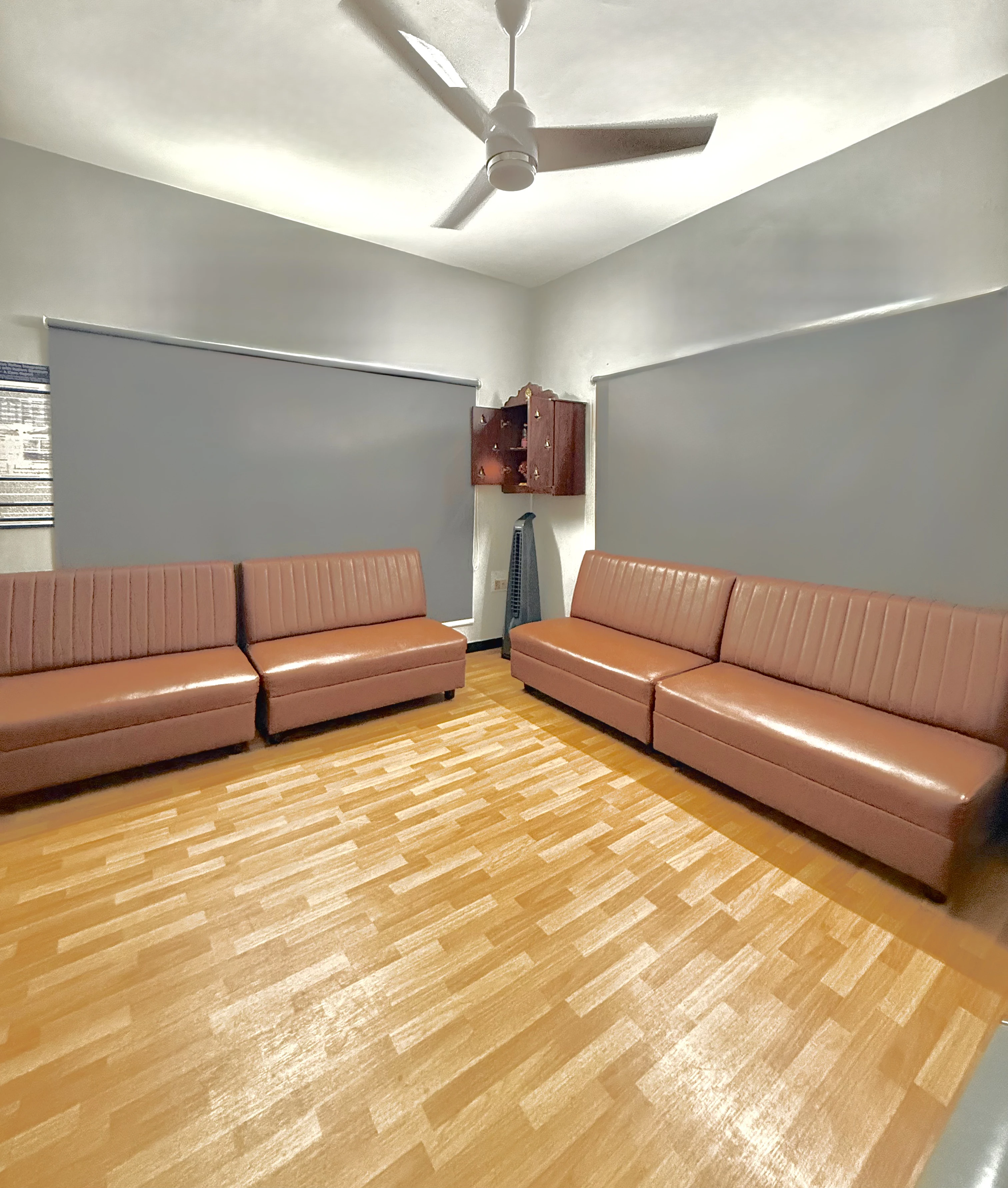 Caring Vision Therapy Ashok Nagar Chennai – Patient waiting area with comfortable leather sofas