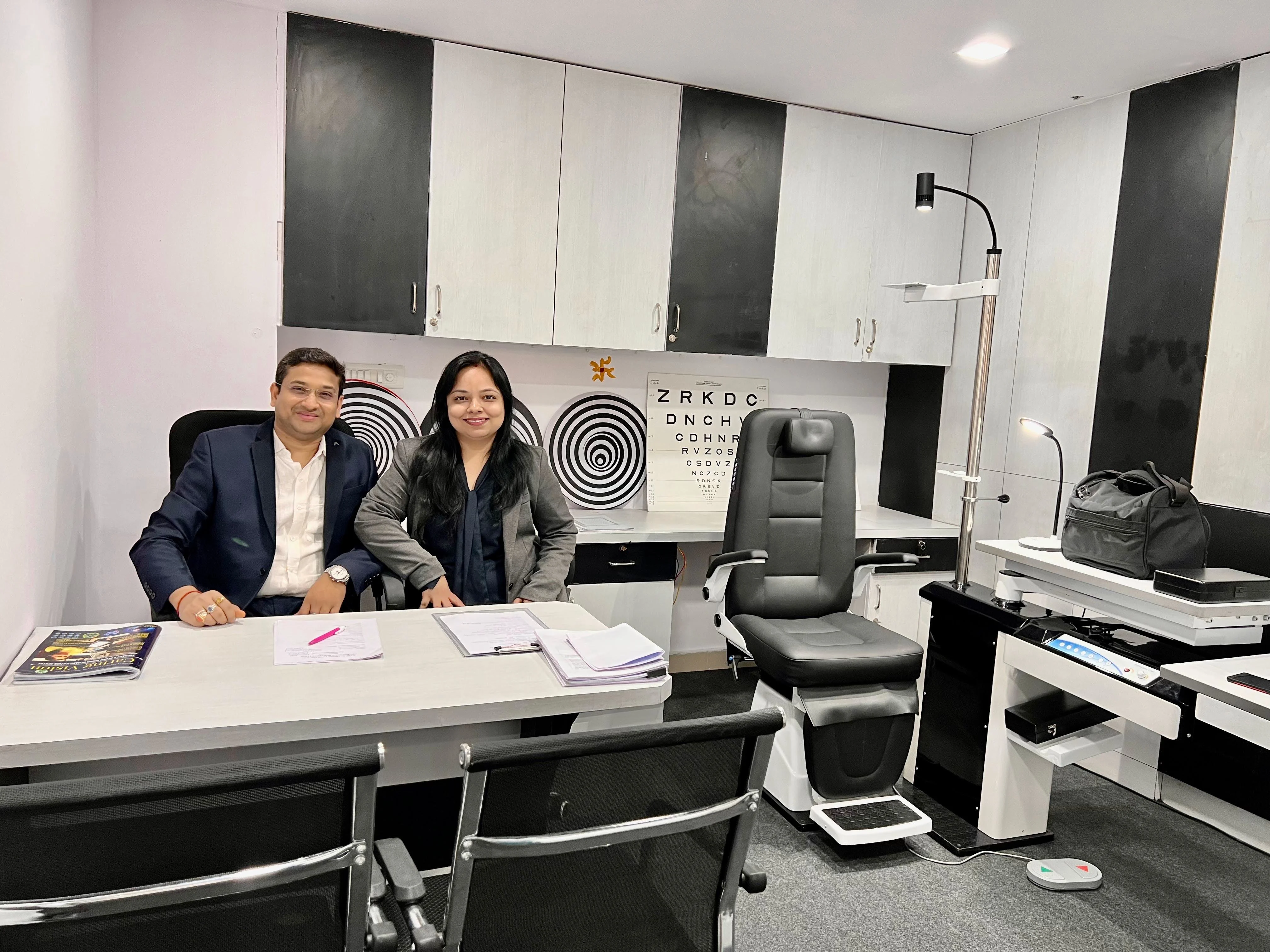 Caring Vision Therapy Hyderabad – Doctor's consultation room with Snellen eye chart, examination chair and clinical desk